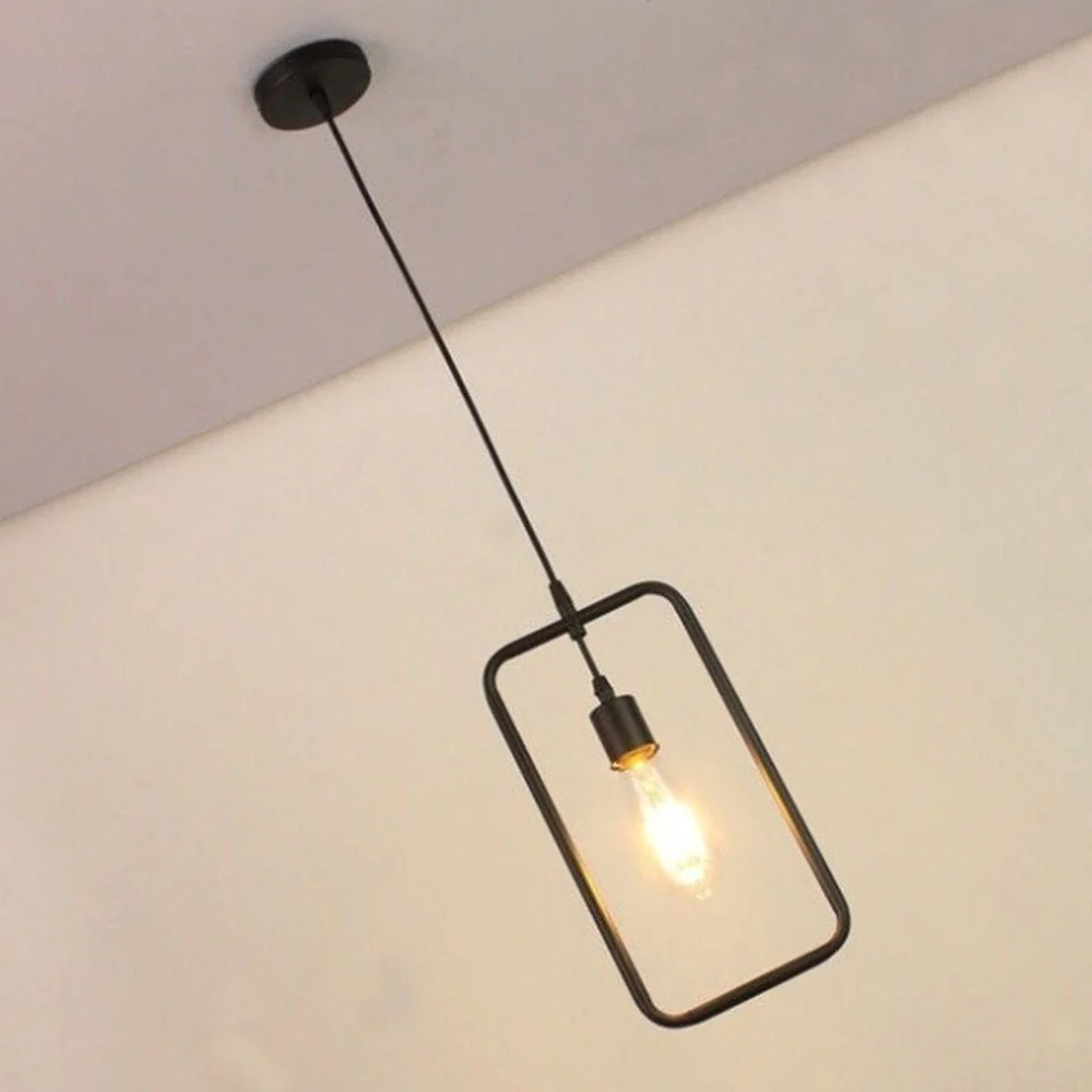 Black pendant lamp featuring a rectangular wire shade, 17 cm diameter, 32 cm height, with a black PVC cable running from the ceiling.