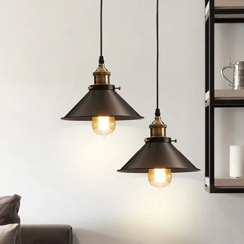 Vintage pendant light with flat black shade, round canopy, brown fabric cable, 22 cm diameter, 10 cm height.