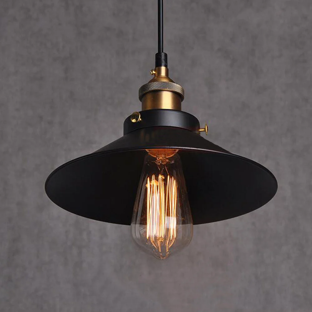 Modern pendant light with black fabric cable, matte black shade, round canopy, gold lamp holder