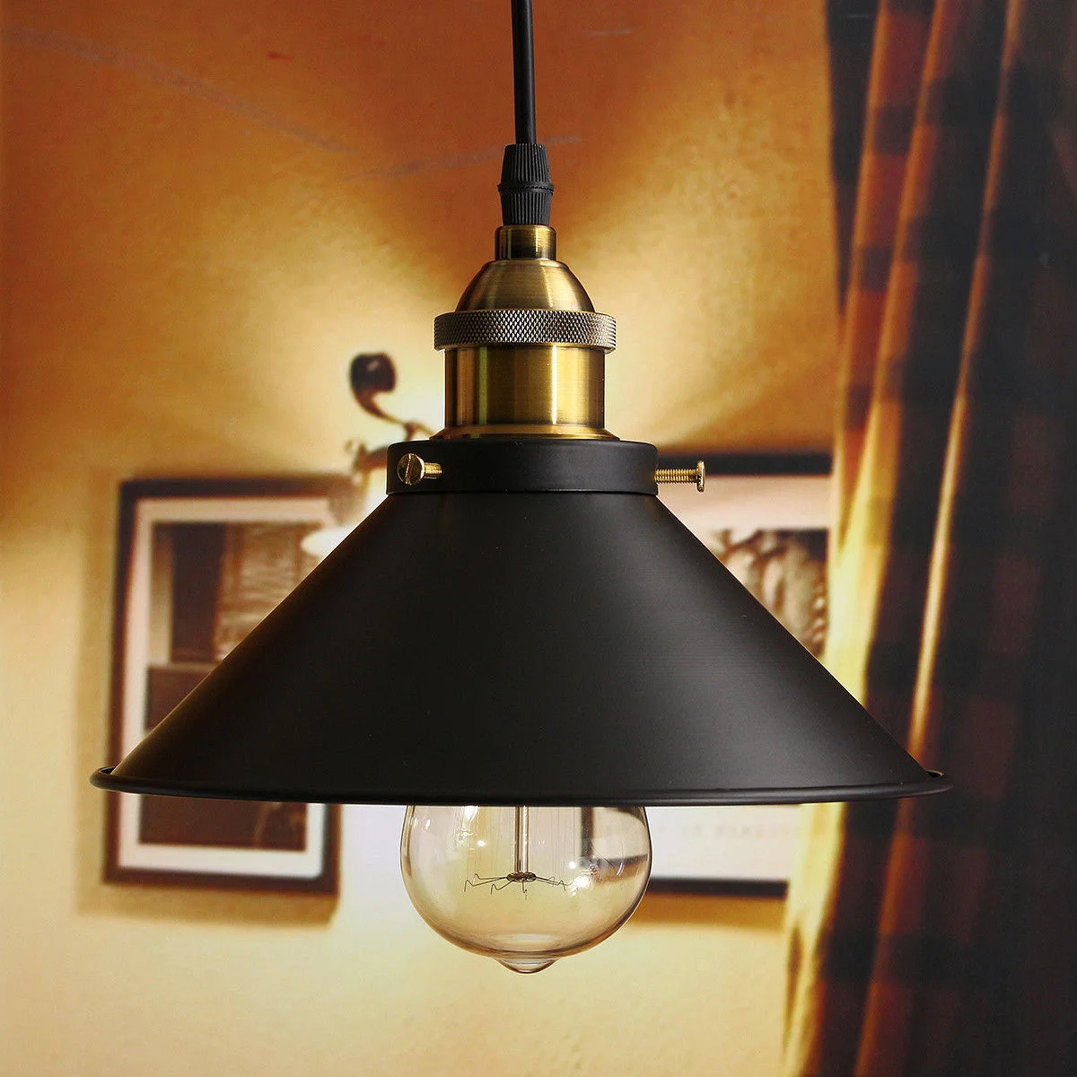 Black matte pendant lamp with gold lamp holder, round canopy, black fabric cable, E27 socket – a vintage bedroom light.