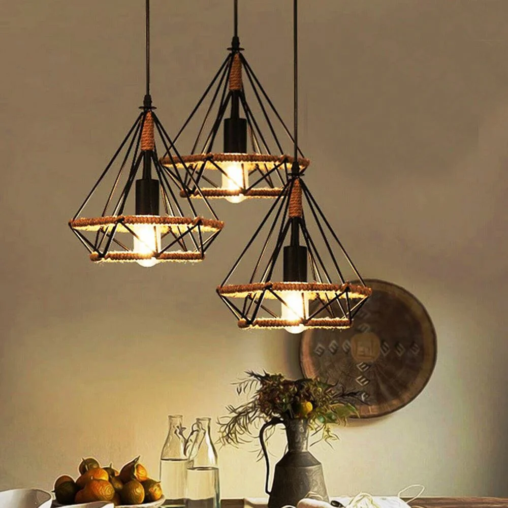 Black metal pendant light with three decorative cages and long PVC cable, mounted on a 20cm ceiling plate.
