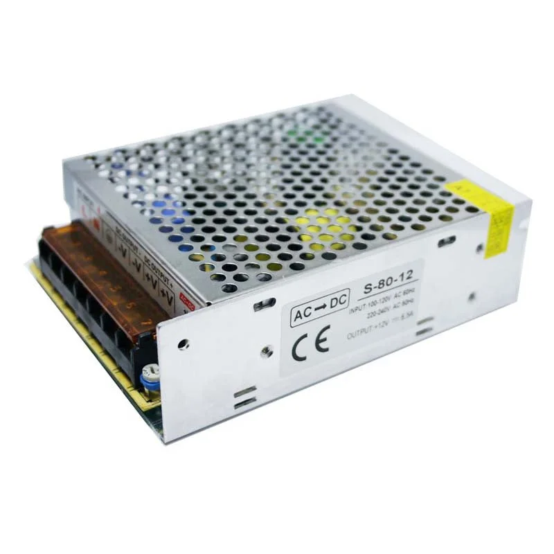 Compact aluminium alloy 12V switching power supply with screw terminals, built‑in fan and 80W output, shown in boxed packaging