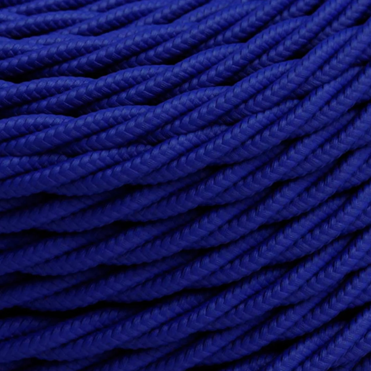Dark blue 240V electrical cable with three twisted copper and PVC cores, woven fabric finish, flexible & 6mm diameter.