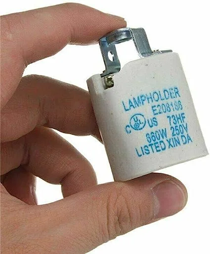 Vintage metal and porcelain E27 heat bulb holder with screw terminal connections.