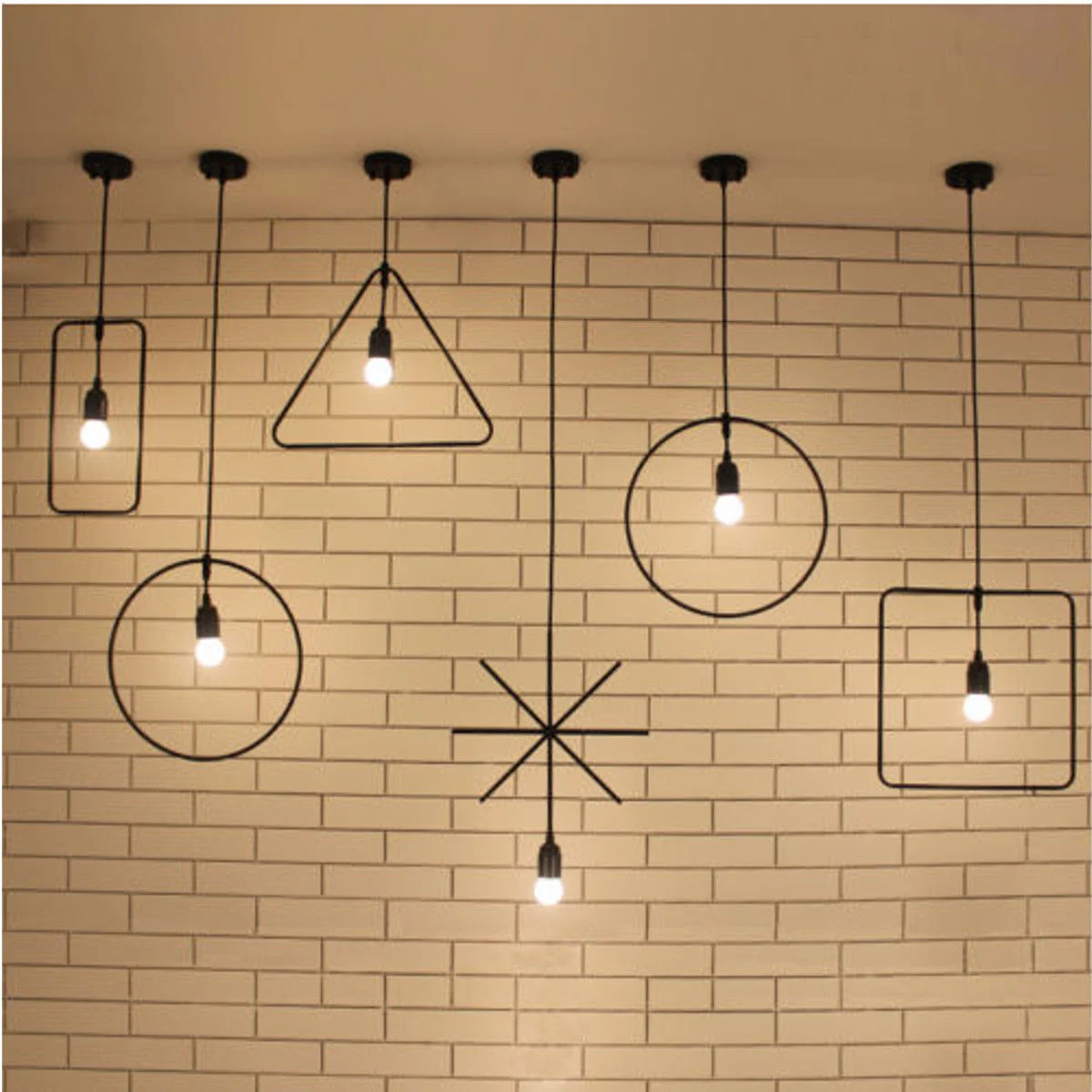 Black pendant lights with a 37 cm round black fabric shade hanging from a ceiling, cable 100 cm of black fabric.