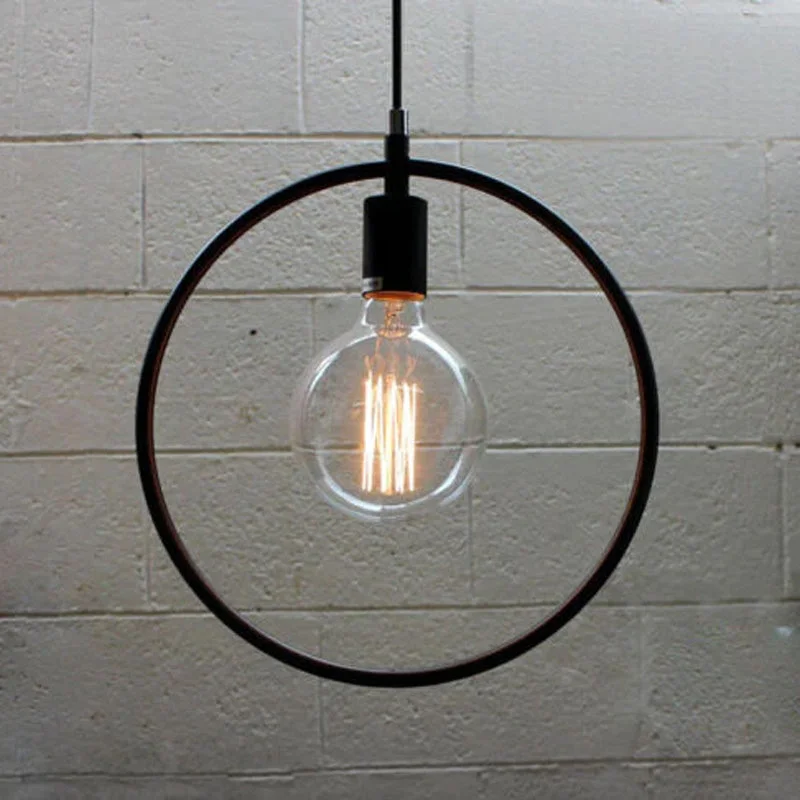 Black metal pendant light with circular shade, 36cm diameter, hanging from ceiling with adjustable 95cm cable.