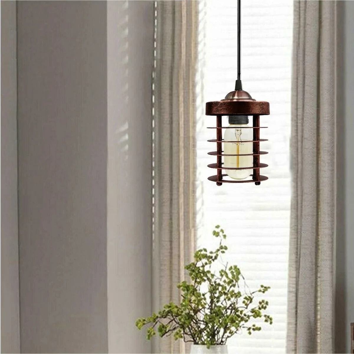 Vintage cylinder pendant lamp shade in black metal cage frame, clip‑on mounting ring visible.