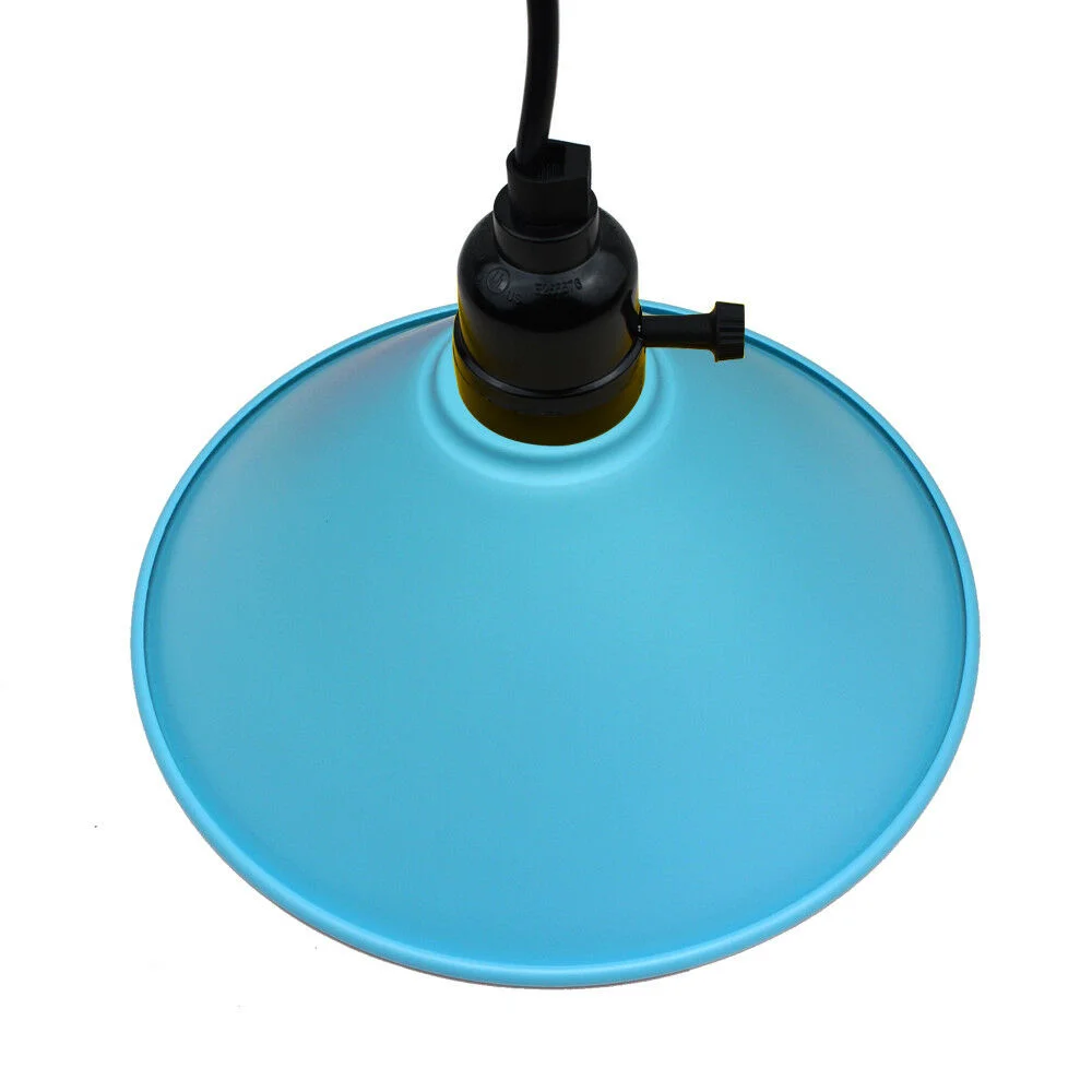 Modern pendant light with blue lampshade hanging from black fabric cable, showing a stylish ceiling canopy design.
