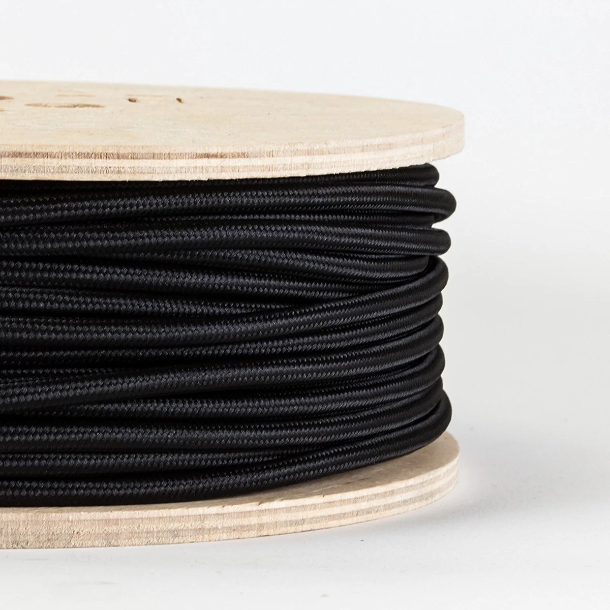 Premium black 3 core fabric lamp cord with round braided textile sheath and copper cores, ready for pendant or floor lamp use.