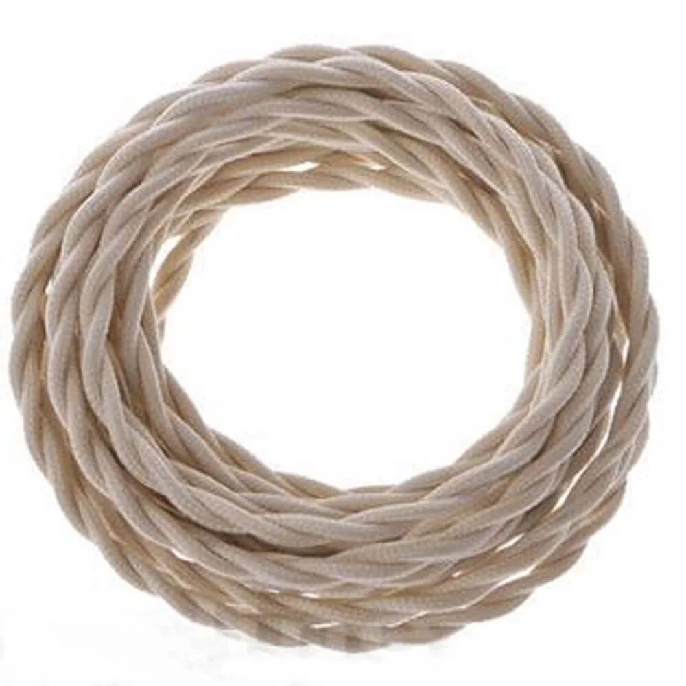Cream twisted lighting cord coiled with two exposed copper cores, flexible fabric cable for indoor light fixtures.