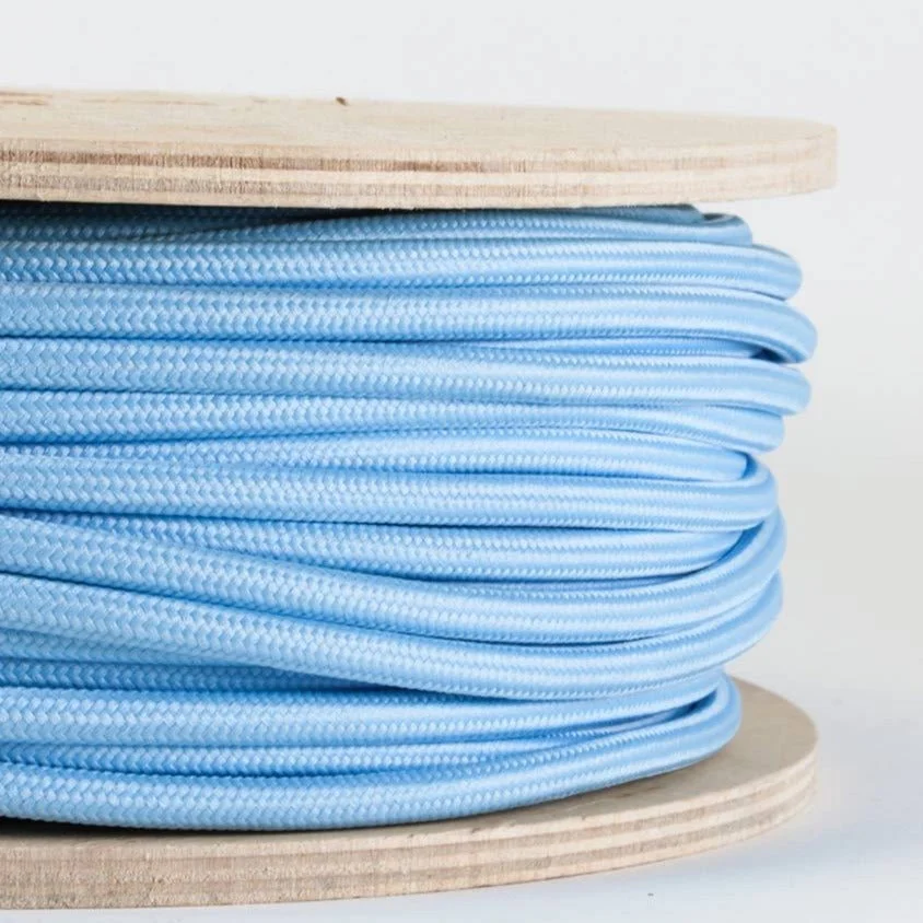 Cable of 6mm diameter, blue cloth‑braided round cable for indoor 240V electrical use.