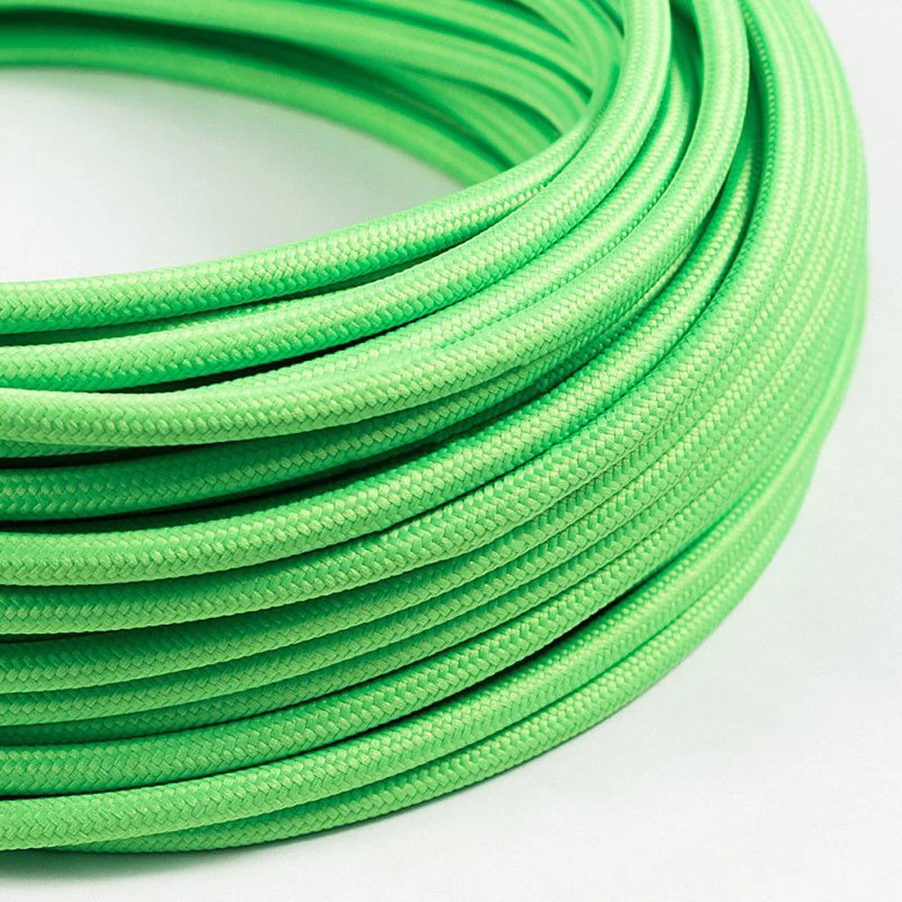 Light green round fabric braided electric cable, 6mm thick, with visible double insulation, rolled up.