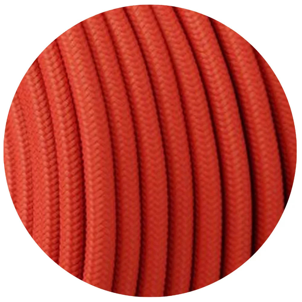 Vintage peach round 2 core braided cable with exposed copper conductors, shown half‑roll ready for lighting projects.