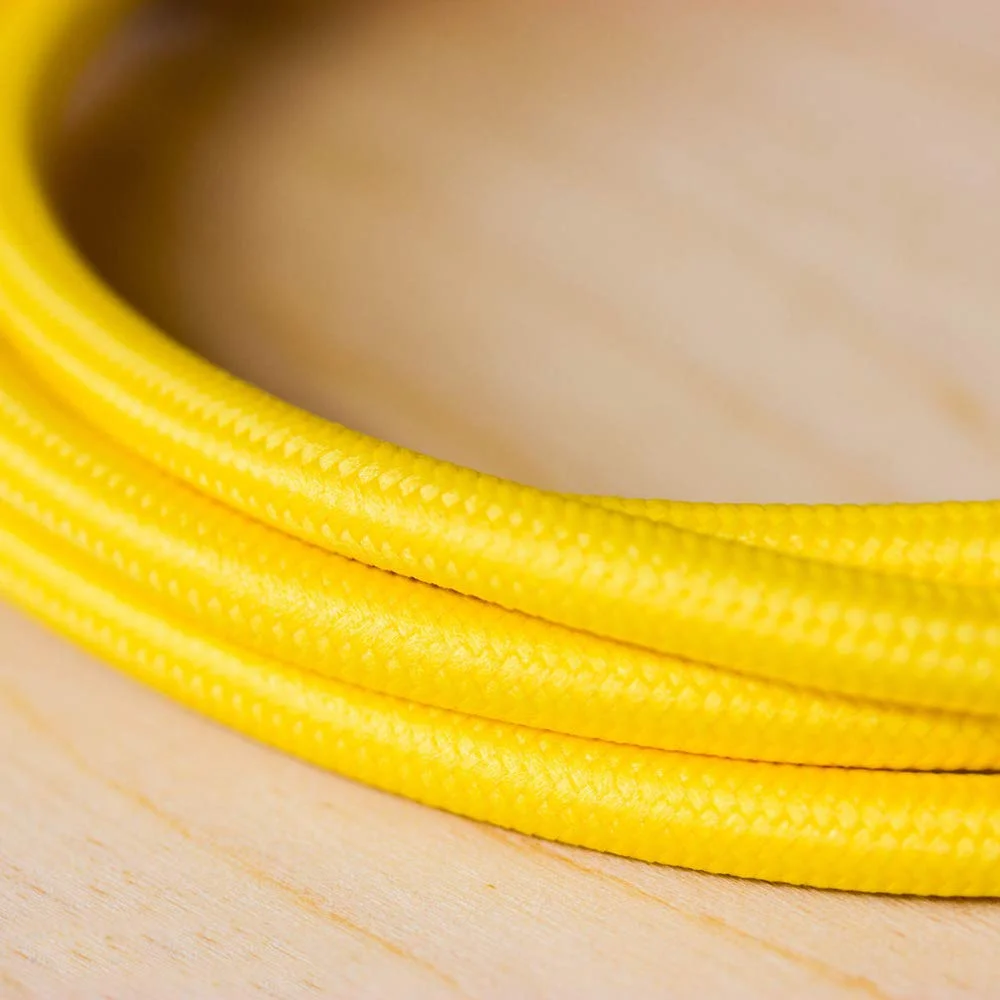 Yellow vintage 2‑core round braided fabric cable roll, highlighting flexible fabric cable for decorative lighting