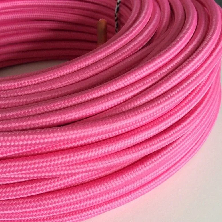 Rose pink 2‑core round braided lamp flex cable, 6 mm outer diameter, showing fabric weave on a flat surface.