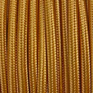 Gold fabric lighting cable neatly coiled, showing 2‑core round design with braided fabric and PVC insulation.