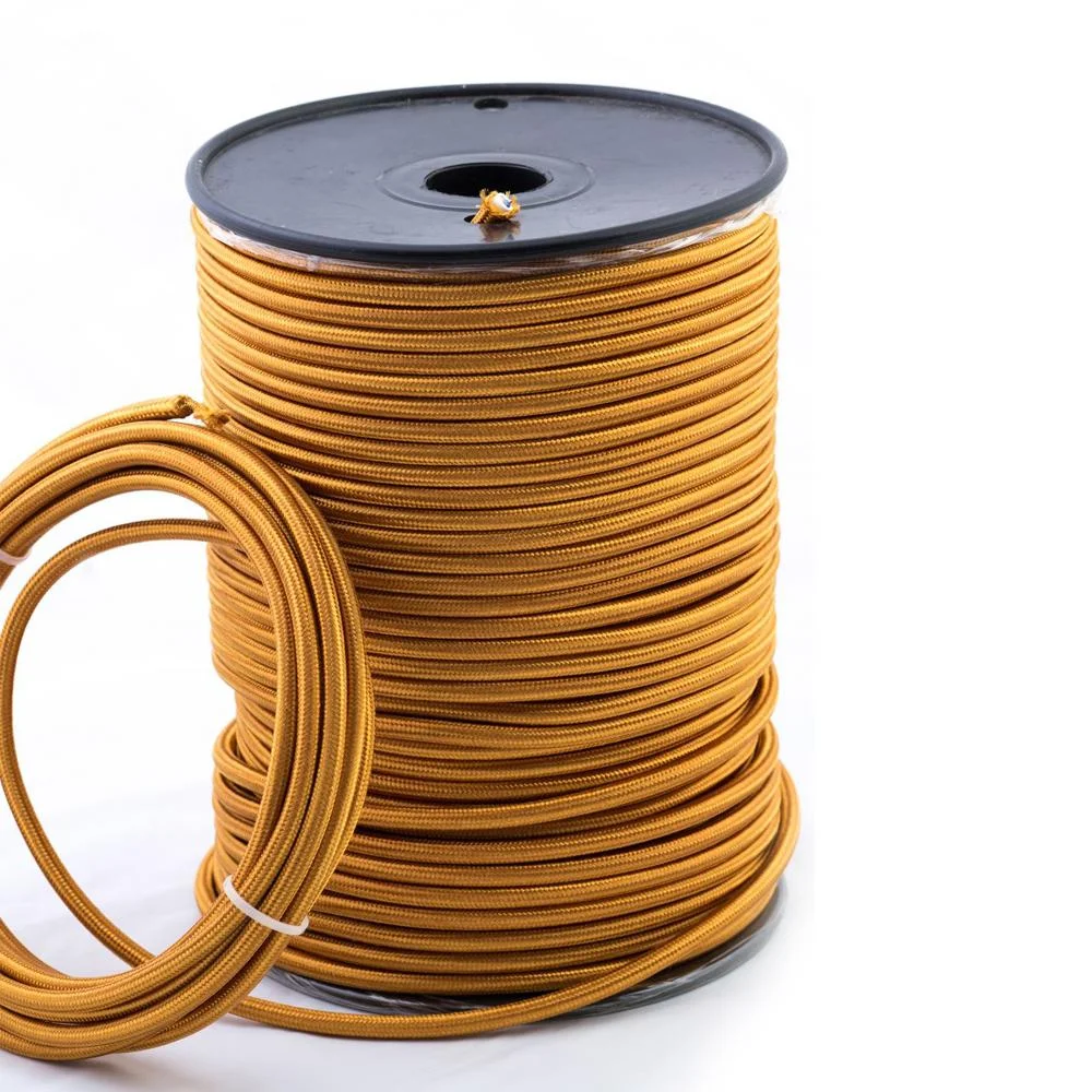 Gold fabric braided indoor lighting cable, 2‑core round with PVC insulation and copper conductors.