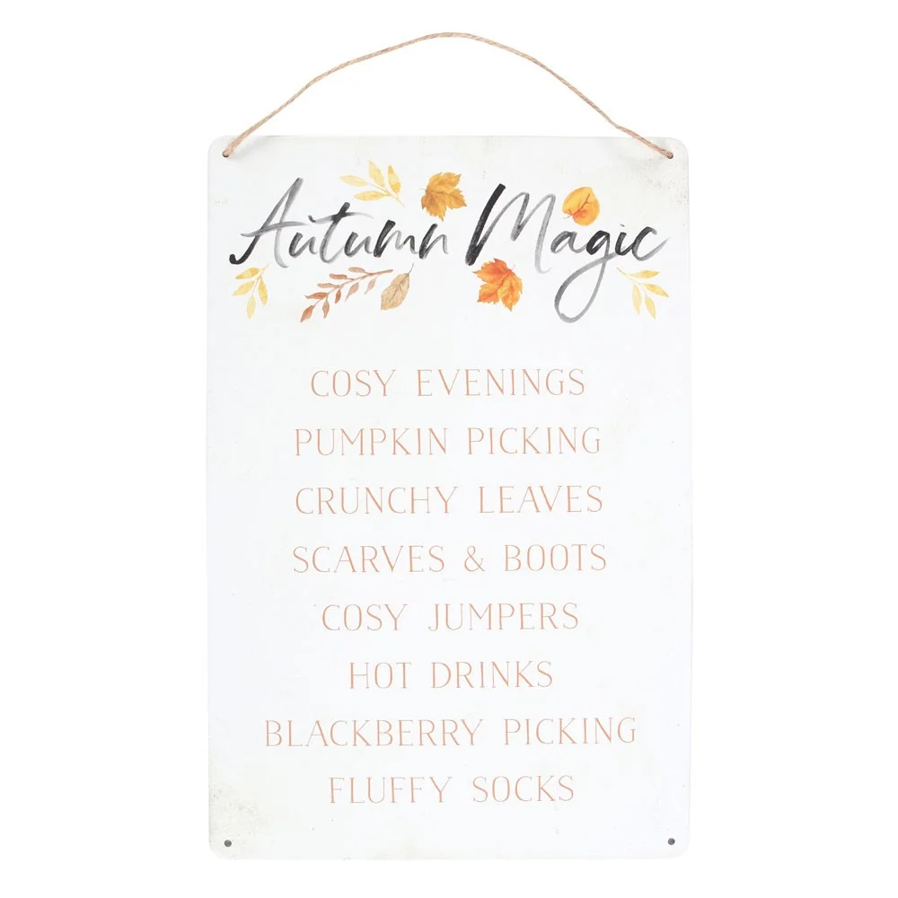 Autumn metal hanging sign with painted leaf design and cozy autumn-themed text in warm colors