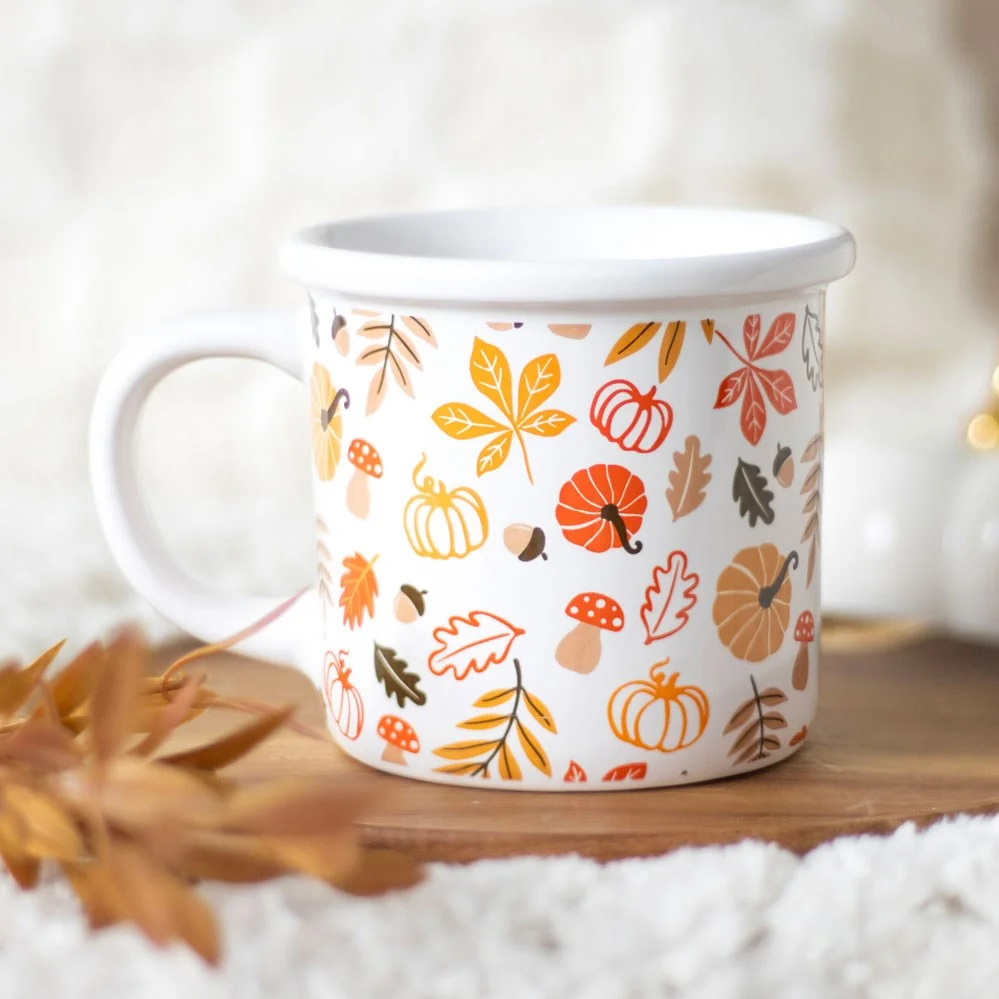 Chunky autumn leaves mug with orange and red leaf and pumpkin design, 480ml capacity, handwash only.