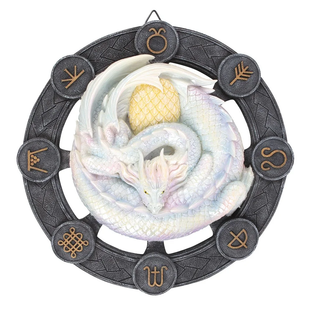 Anne Stokes dragon wall plaque featuring white Ostara dragon coiled around egg with sabbat symbols circle background