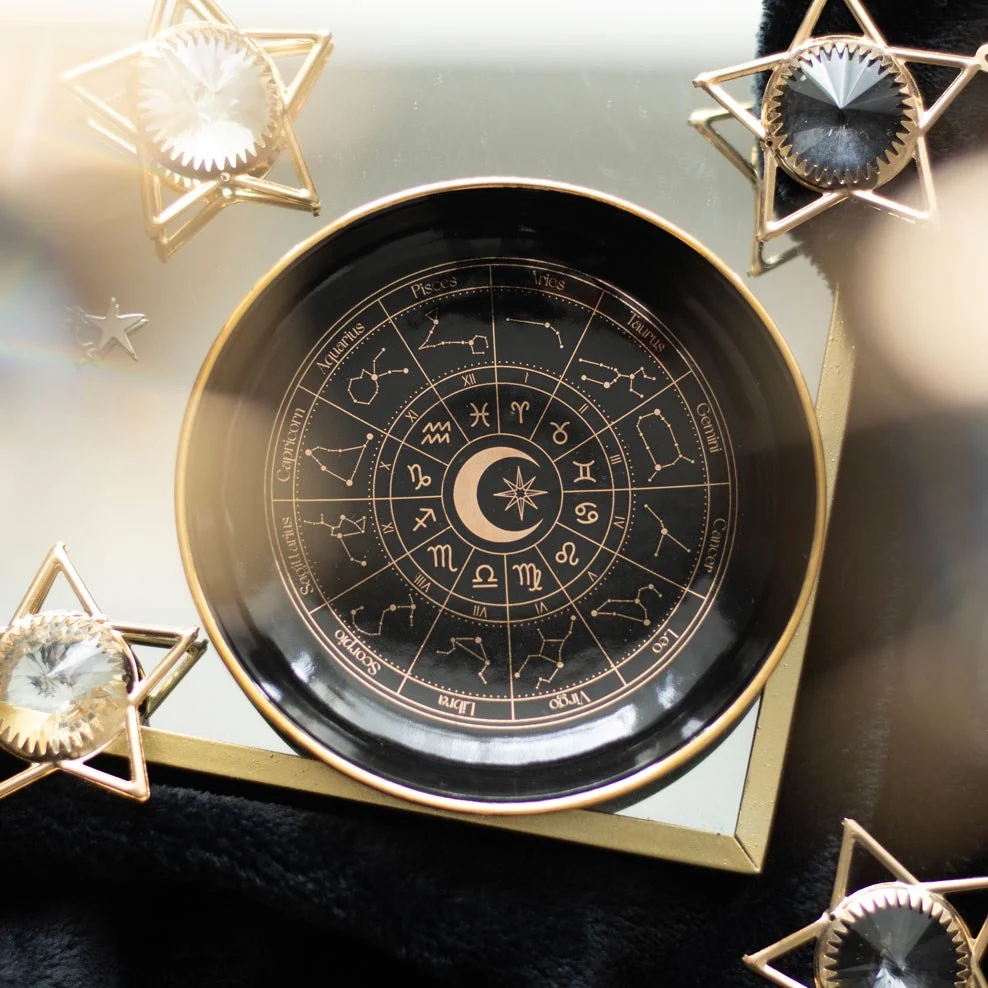 Black astrology trinket dish with gold astrology wheel design, ideal for storing jewellery and small treasures