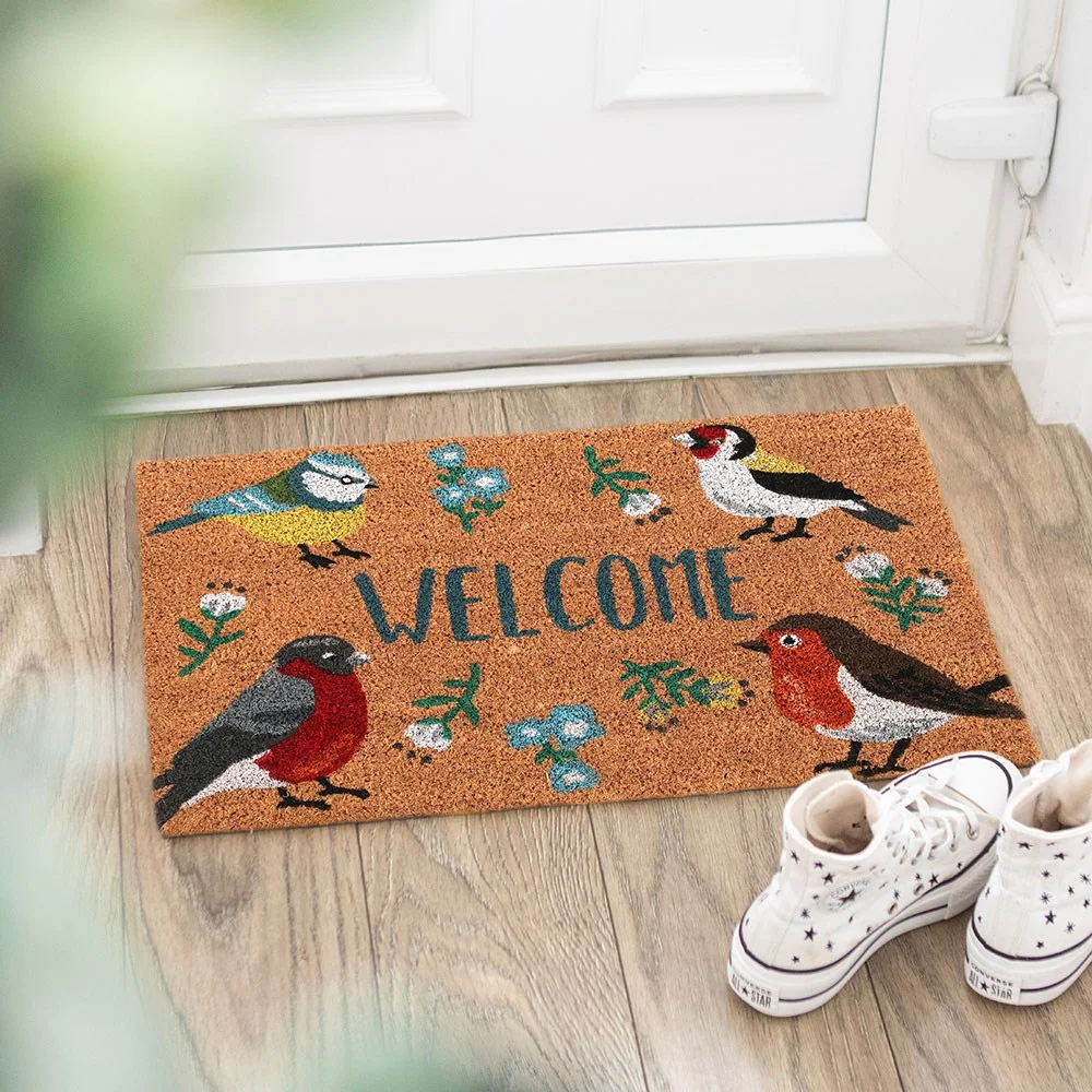 Natural British garden birds doormat with 'Welcome' text and illustrations of Blue Tit, Robin, Goldfinch, and Bullfinch