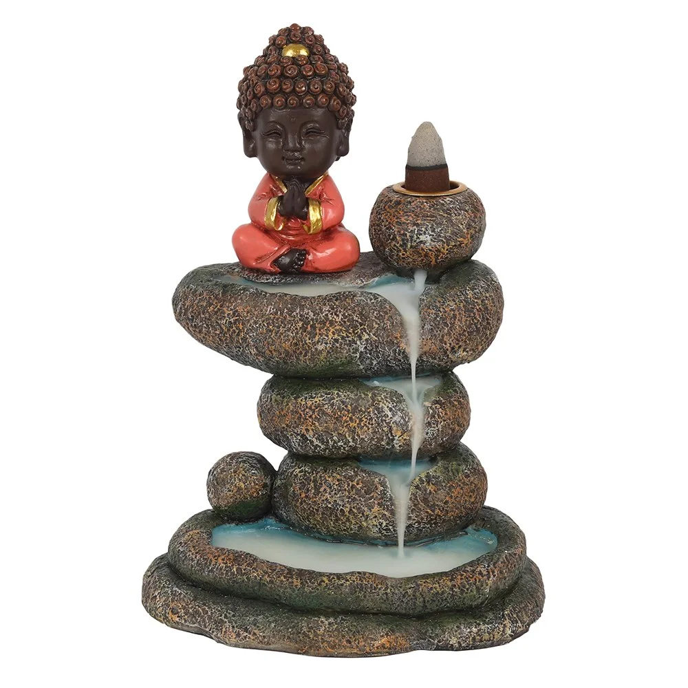 Red Buddha meditating on stacked rock pond backflow incense burner with smoke flowing down the rocks