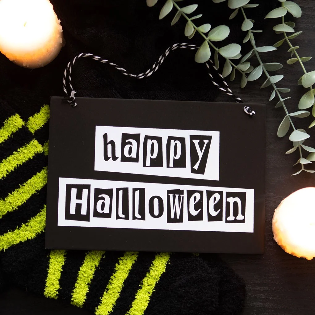 Black and white Halloween hanging sign with "Happy Halloween" text in bold, spooky font for home decoration