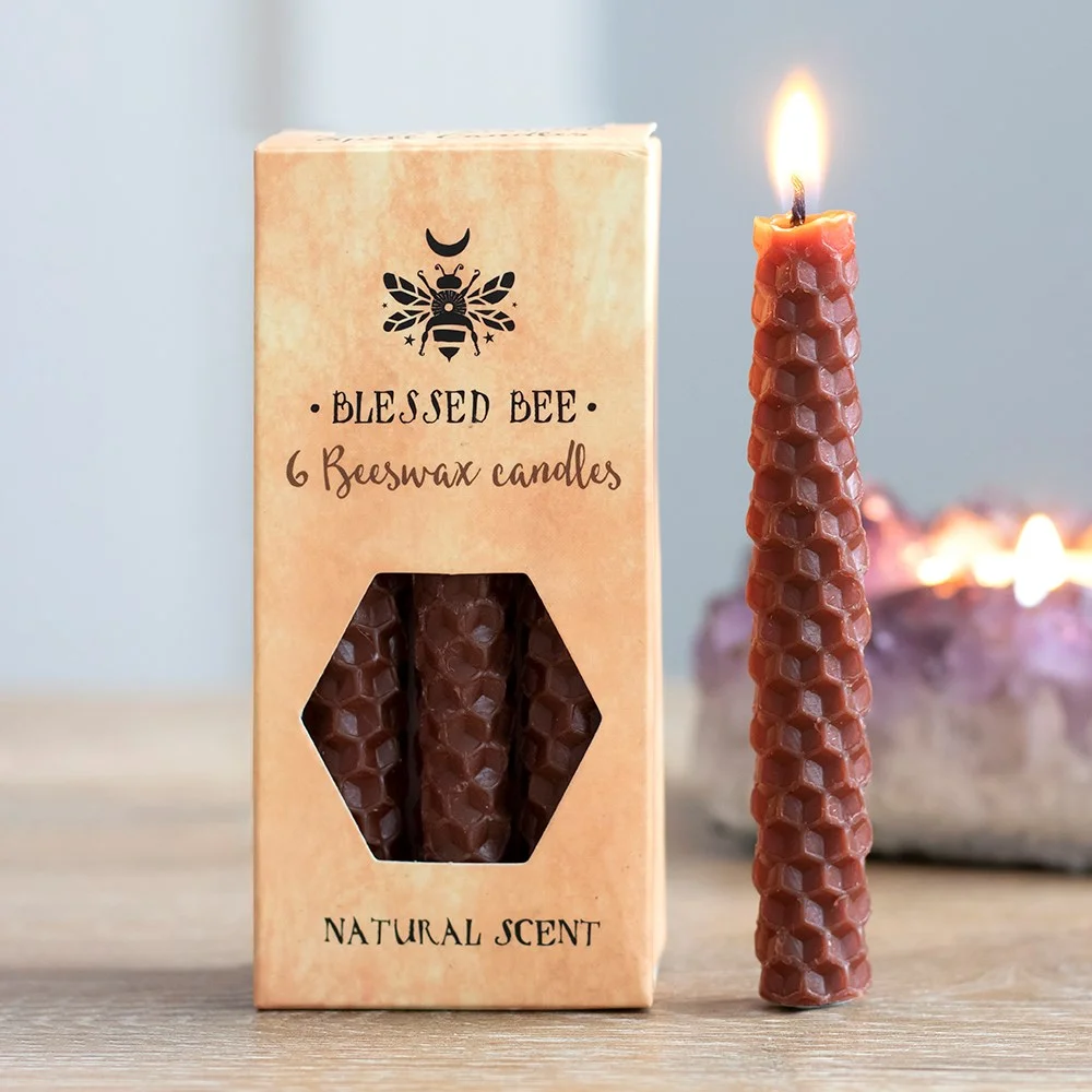 Set of 6 brown beeswax spell candles arranged in a box with a natural light scent and 100% linen wicks