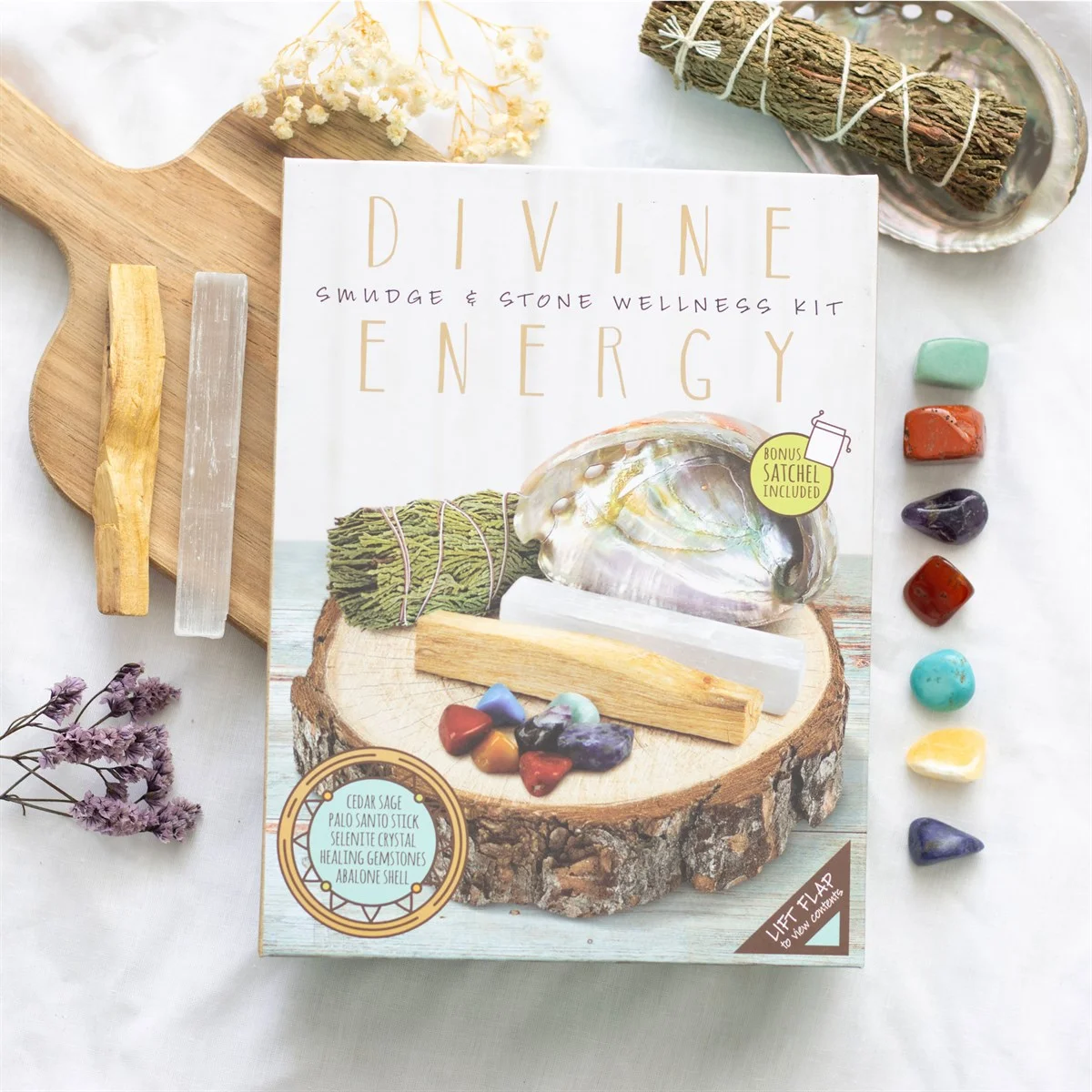 Smudge and stone kit with seven tumblestones, cedar sage smudge wand, palo santo, selenite wand, abalone shell, and drawstring bag