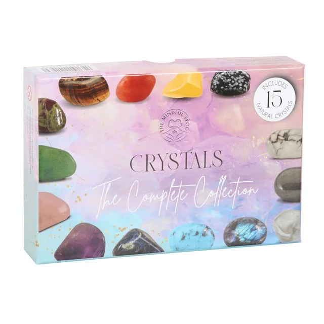 Crystal starter kit with 15 colorful tumblestones in a sliding gift box and an informational guide on crystal healing benefits