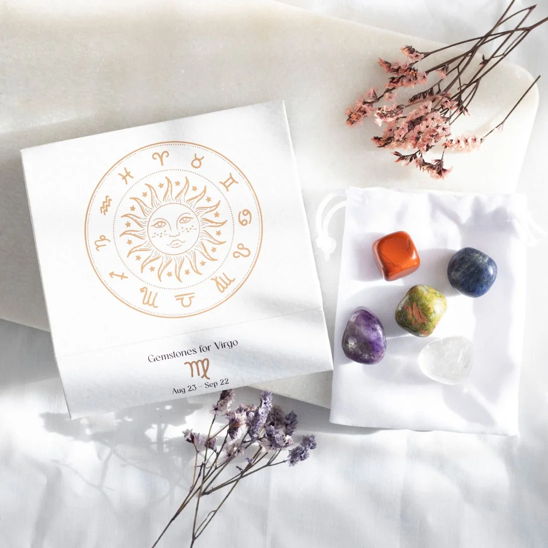 Virgo crystal tumblestone set with five polished stones in a velvet bag and magnetic closure gift box on white background