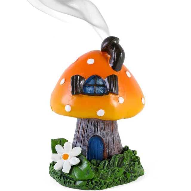 Orange toadstool incense cone holder shaped like a house with chimney for smoke, designed by Lisa Parker, 11.5cm tall