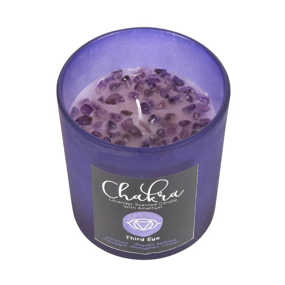 Lavender crystal candle in purple frosted glass with metallic lid and amethyst chips scattered on top