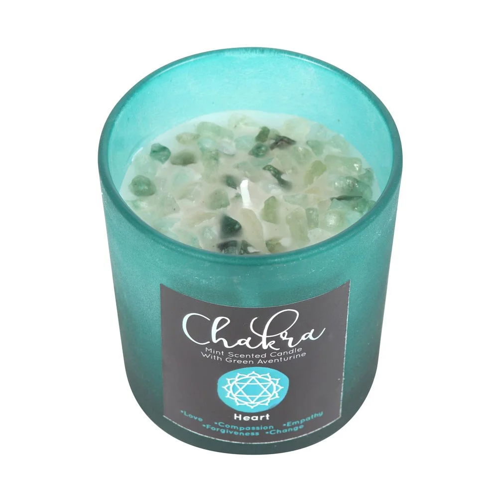 Green frosted glass heart chakra candle with metallic lid and green aventurine crystal chips on top