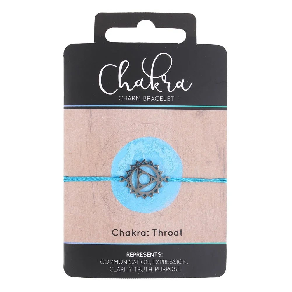 Blue string throat chakra bracelet with metal charm on a backing card reading communication, expression, clarity, truth, purpose
