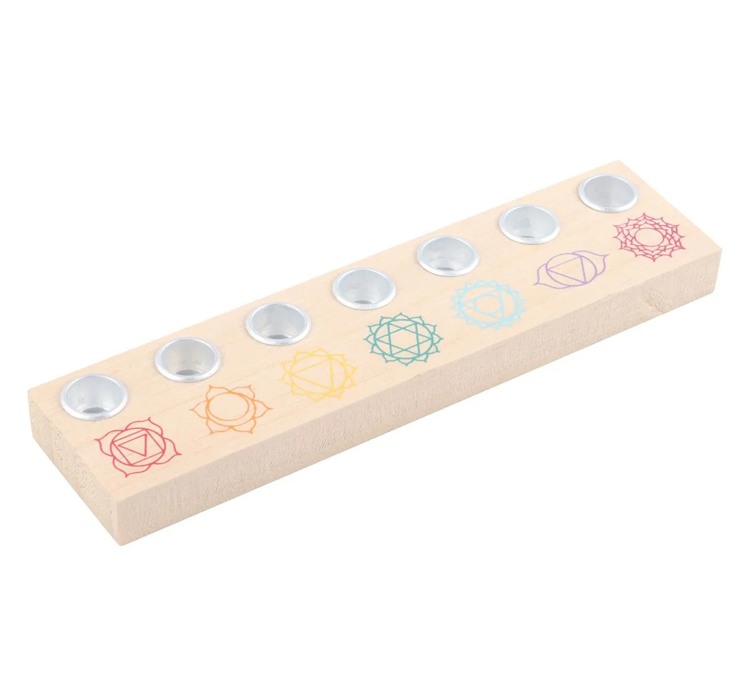 Light wood chakra candle holder with seven metal holders, each painted in vibrant chakra colors, no candles included