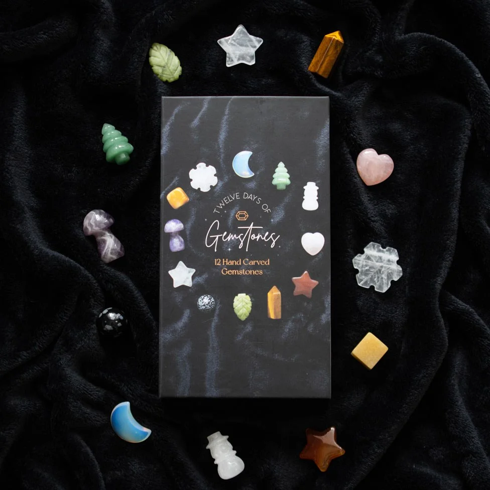 12 Days of Christmas crystal advent calendar with 12 unique carved gemstone shapes in festive designs and colors