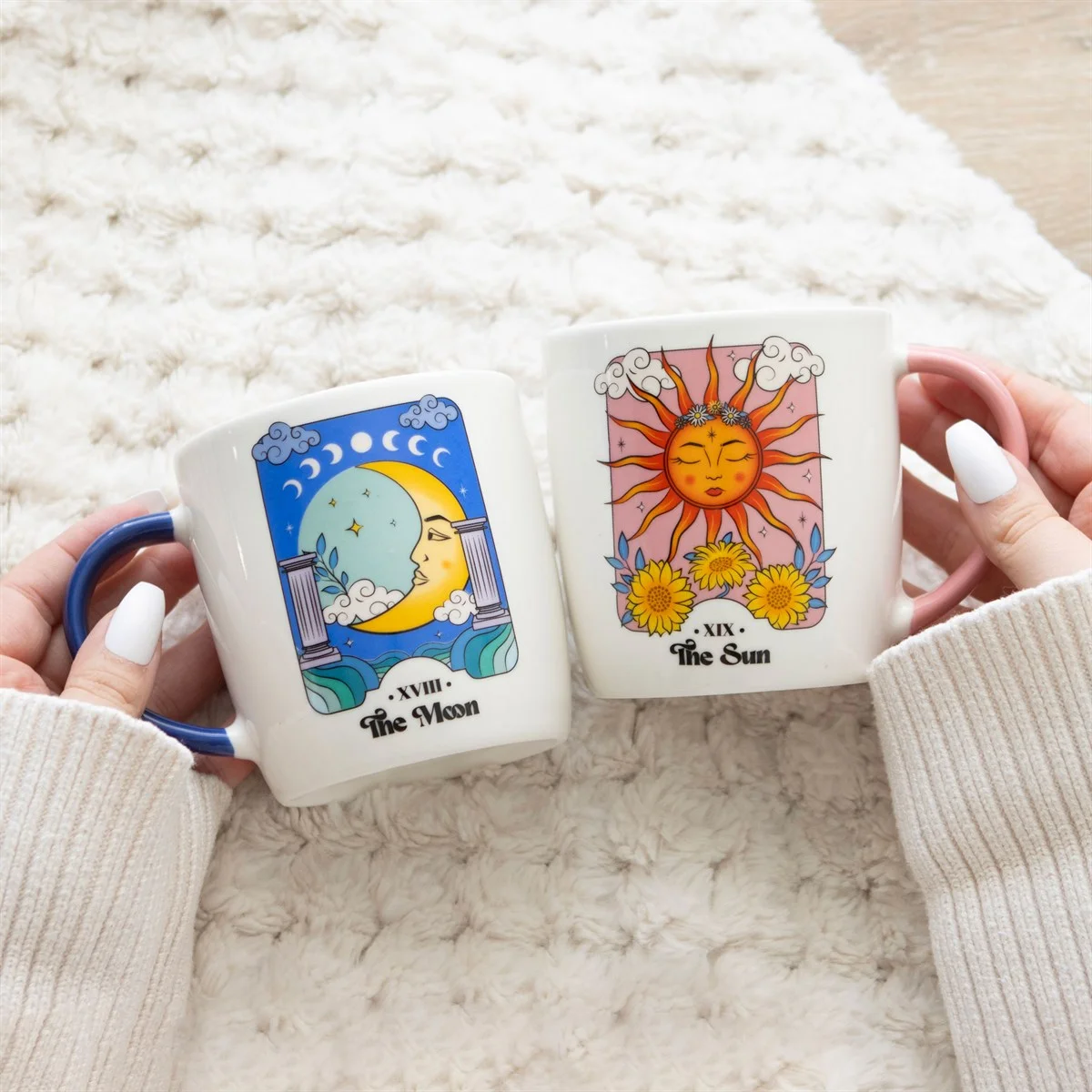 Sun and Moon celestial mug set showing two 340ml ceramic mugs with sun and moon designs, dishwasher and microwave safe