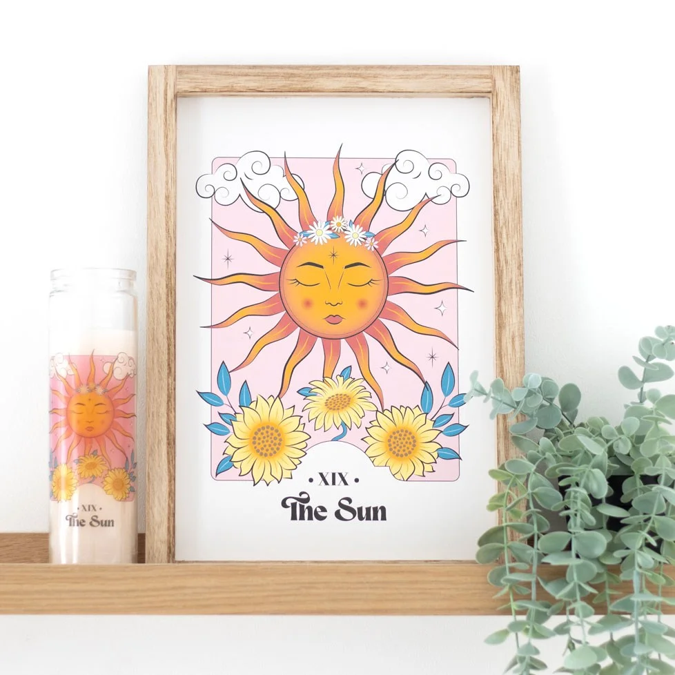 Framed sun wall print featuring a colorful, playful sun illustration in a 25x35cm frame on a white background