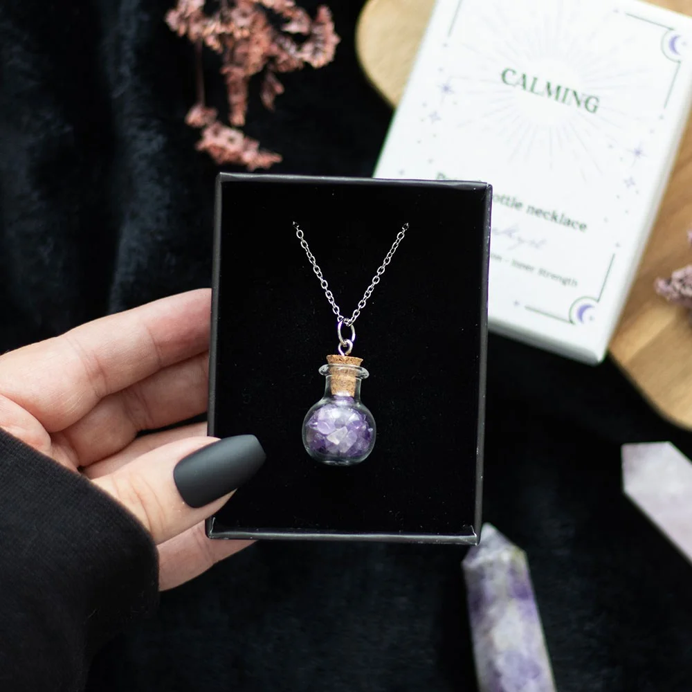 Miniature potion bottle necklace with natural amethyst crystal chips and cork stopper on stainless steel chain