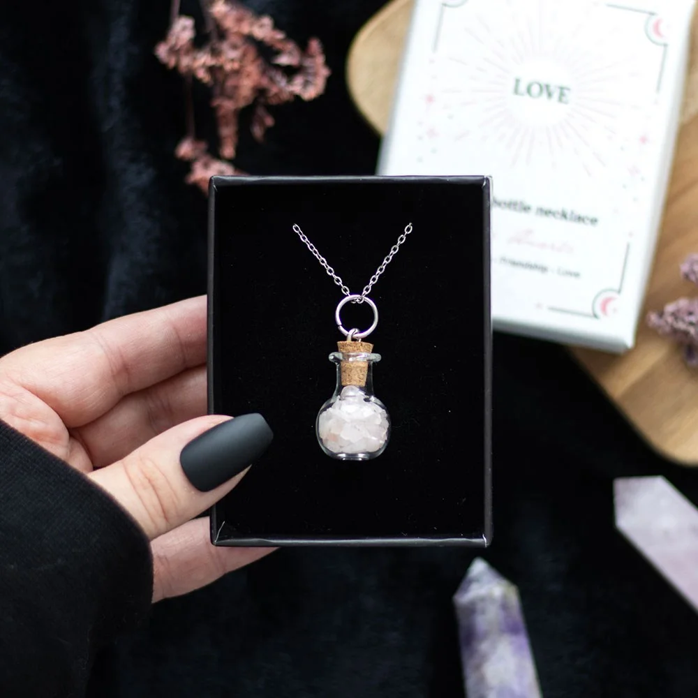 Miniature potion bottle necklace with natural rose quartz crystal chips on stainless steel chain, cork stopper included