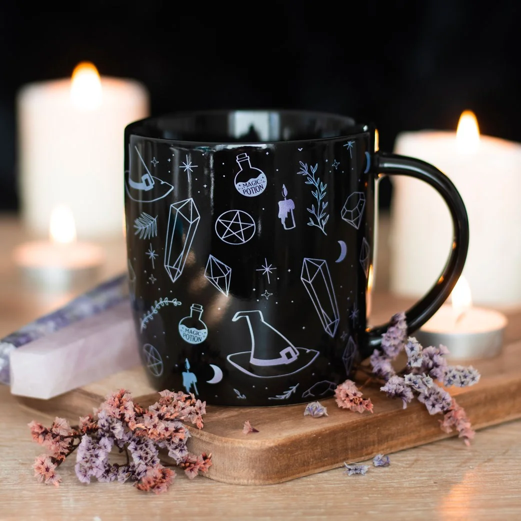 White ceramic crystal witch mug with black crystal magic design, 360ml capacity, microwave safe.