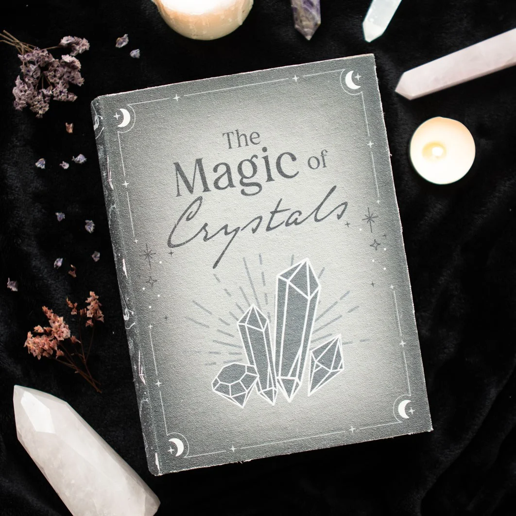 Closed crystal storage box designed like a mystical book with crystals, witch hats, potions, and pentagram motifs