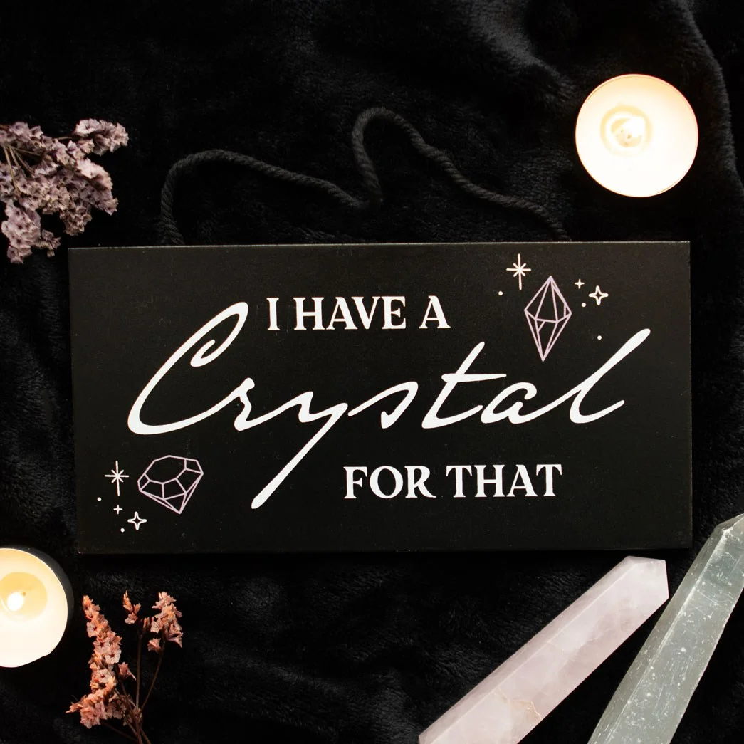 Rectangular wooden witchy hanging sign with "I have a crystal for that" text in decorative font