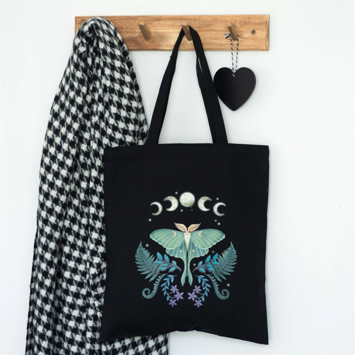Black polycotton tote bag with detailed green luna moth design, spacious for everyday use or shopping