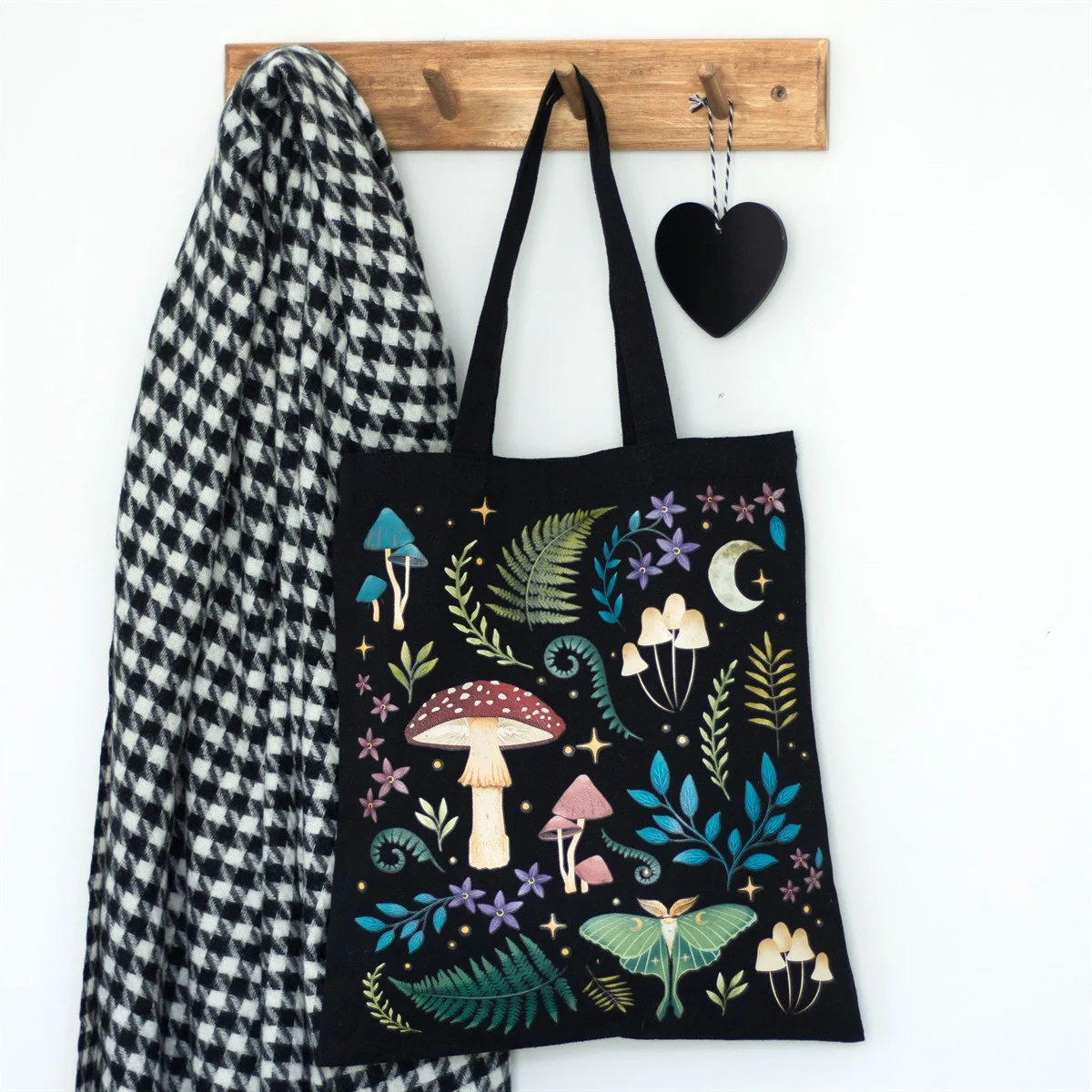 Black polycotton dark forest tote bag with mystical mushrooms, glowing luna moth, and magical plants design