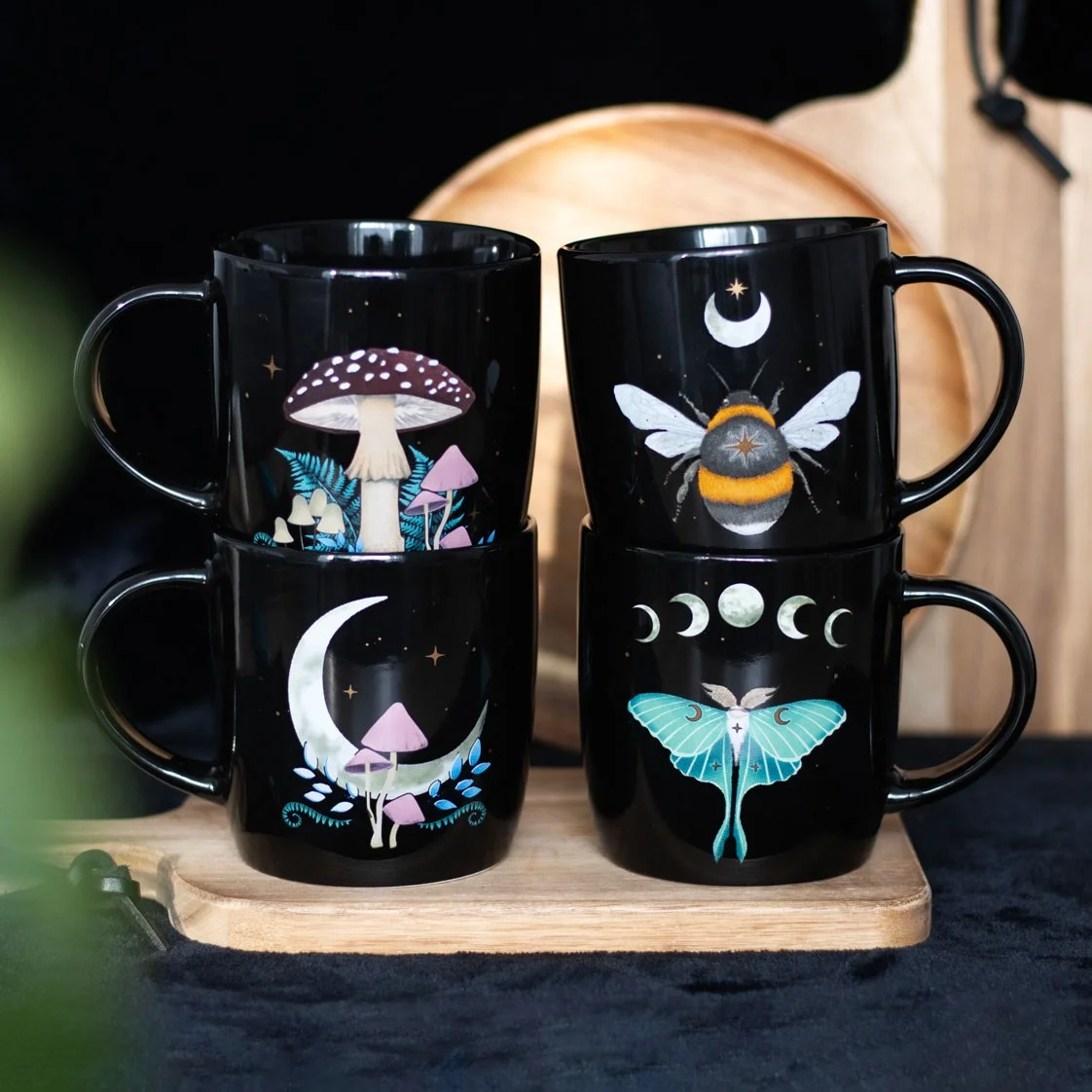 Set of 4 dark forest mugs with luna moth, toadstools, bee, moon and star designs in a matching gift box
