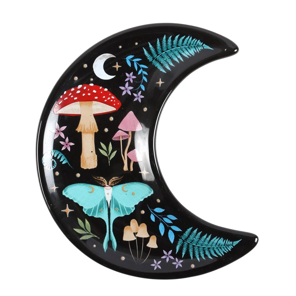 Crescent moon trinket dish decorated with a nocturnal landscape illustration, colourful flora and fauna, and golden star details.