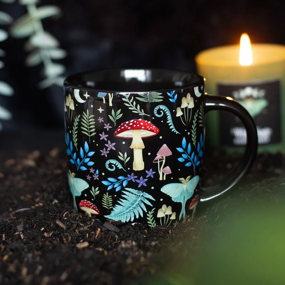 Dark forest mug with all‑over mystical forest design, sleek black ceramic, 340ml capacity, dishwasher and microwave safe.